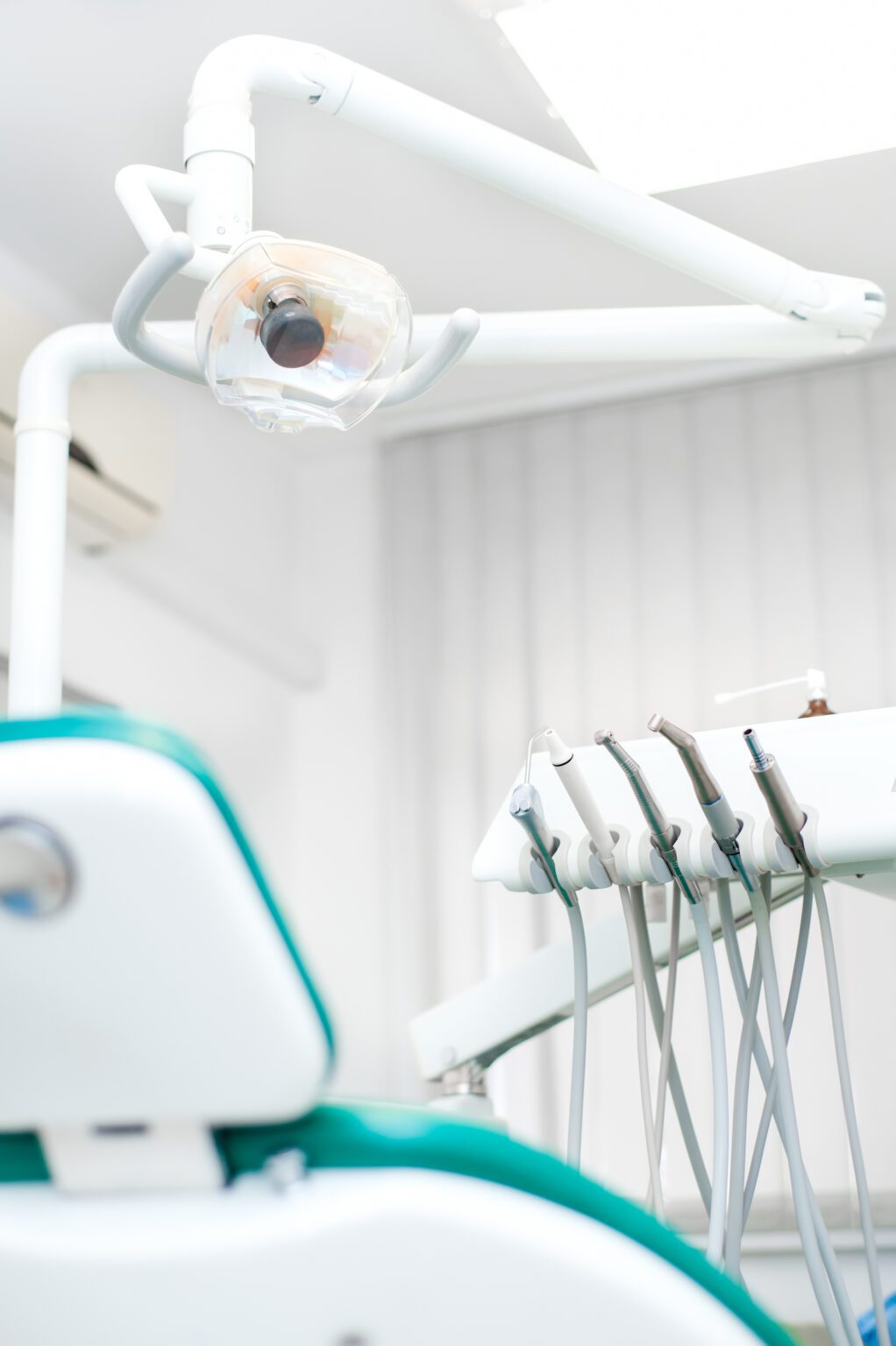 Close-up view of dental tools and professional chair at dentist medical clinic
